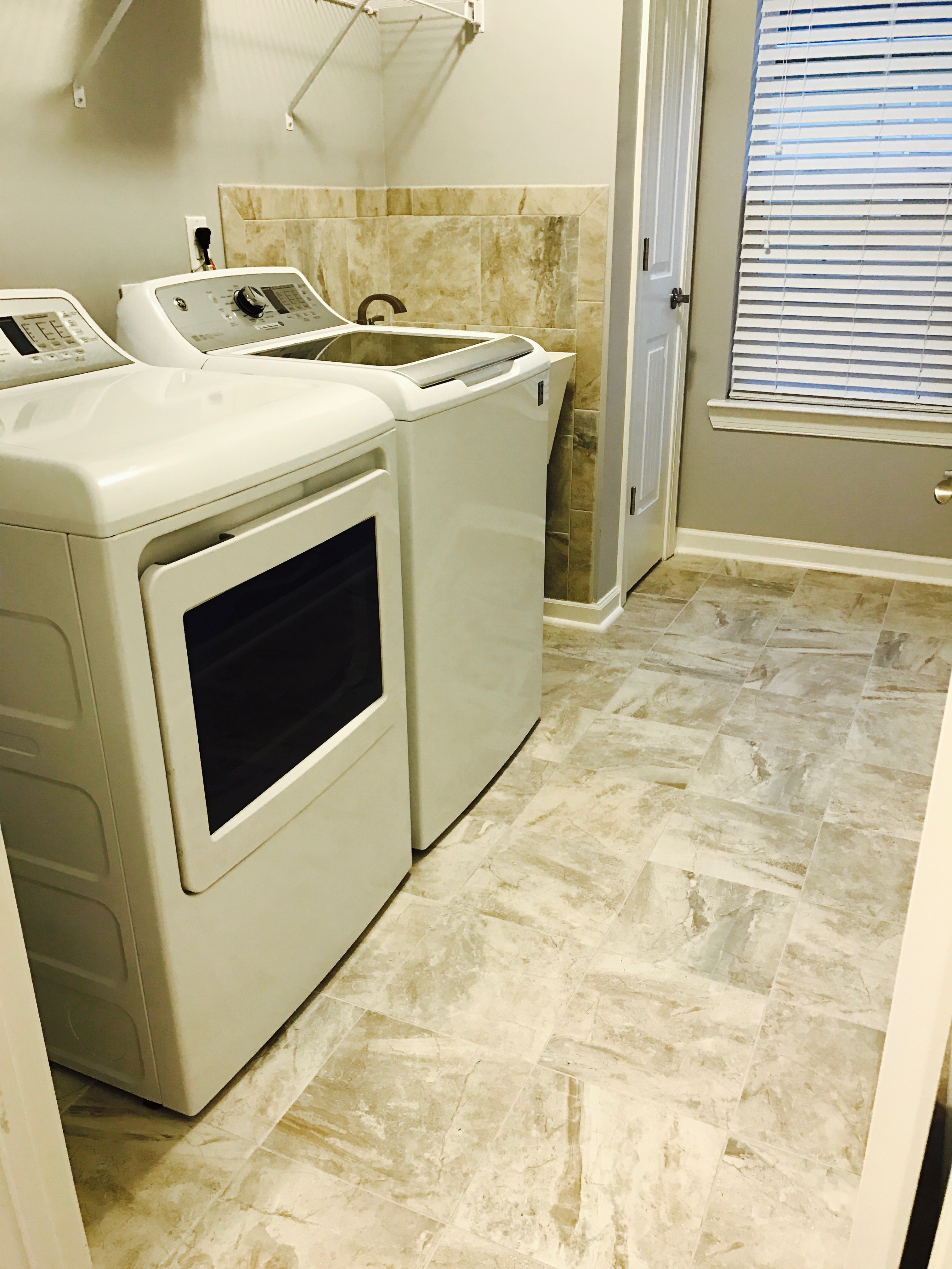 tiled laundry room general contractor blount's complete home services fire water restoration termite pest control augusta ga