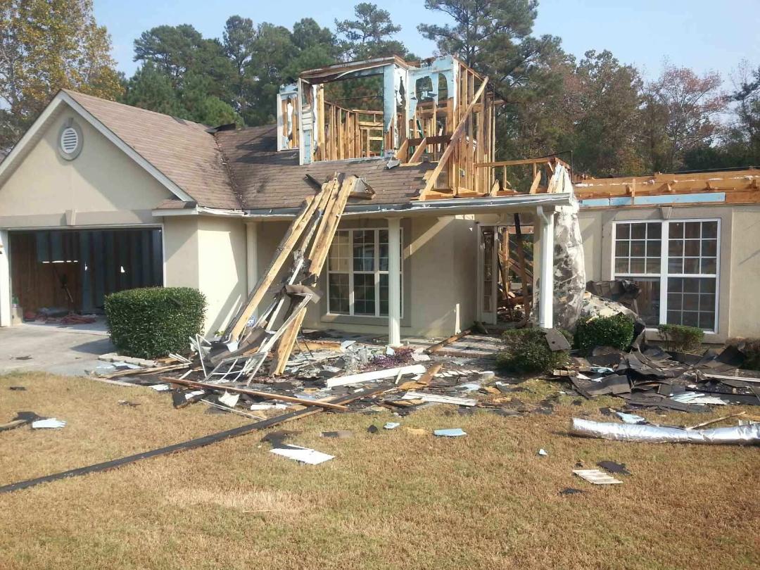 Front of home damaged by fire blount's complete home services fire water restoration termite pest control augusta ga